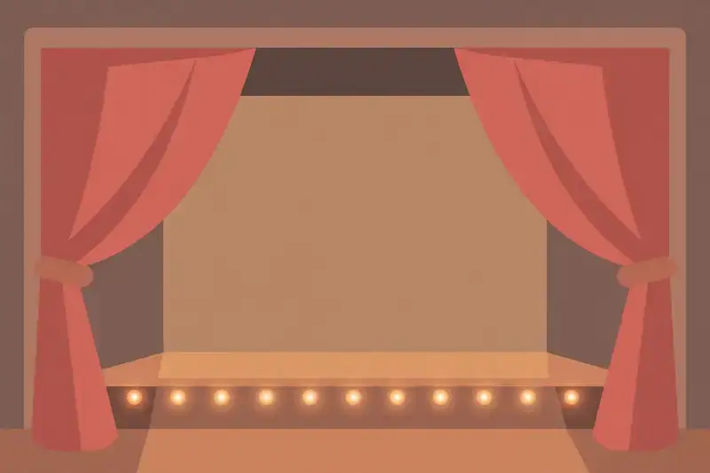 An empty theater stage with open red curtains and warm footlights